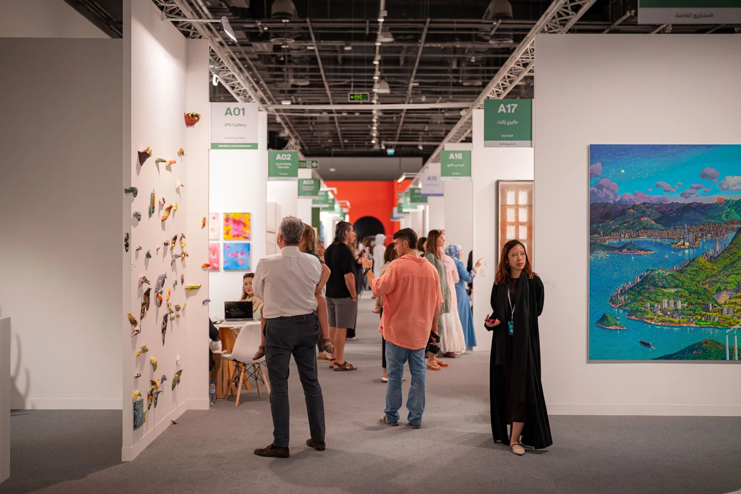 Visitors and gallery stands in an archive art-fair photograph published by Frieze.