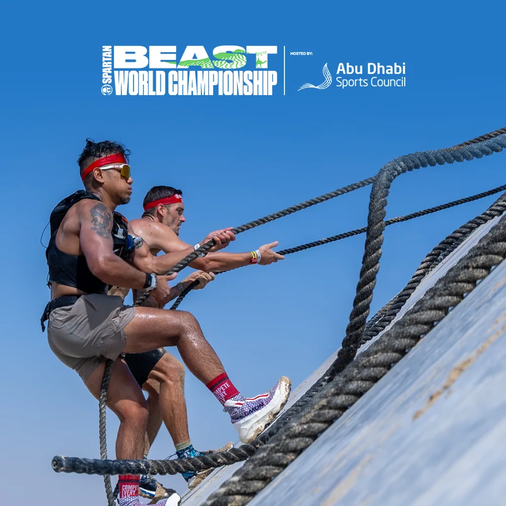 Competitors on an obstacle. Spartan World Championship promotional image.